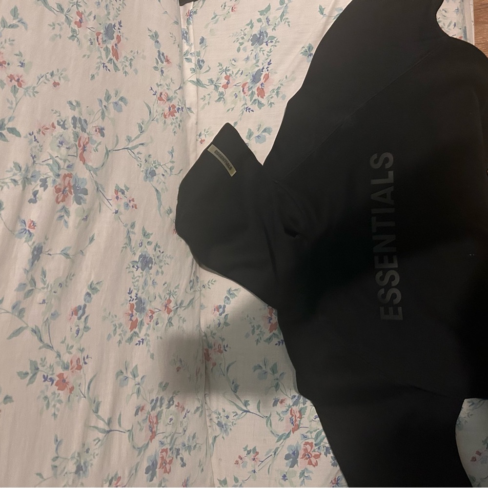 Brand new essential hooddie comes with bag.